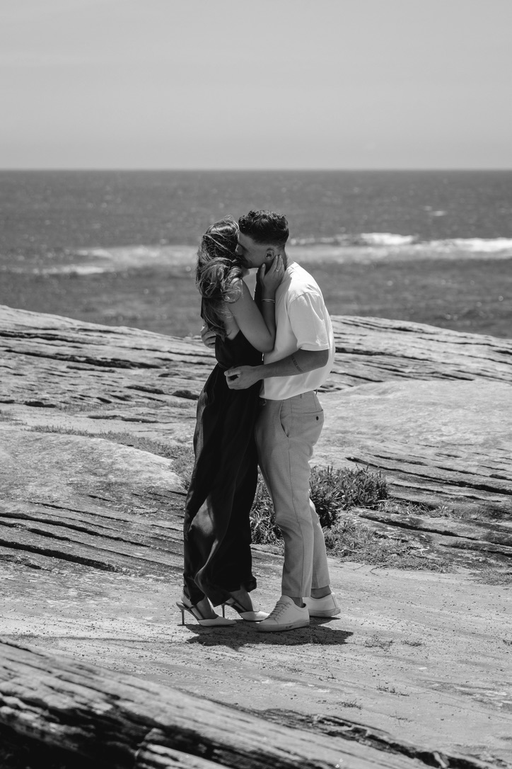 Black and white portrait of the couple embracing